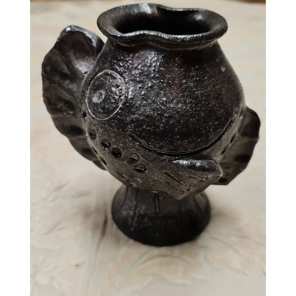 Vintage Vase Initialed BKH 2002. Many differant faces depending on how it sits.